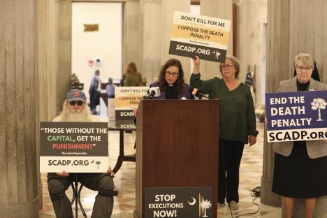 Advocates protesting against the death penalty at a press conference.