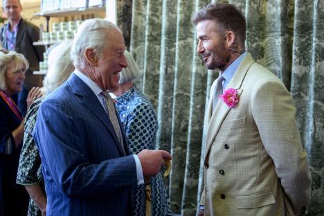 King Charles III and David Beckham speaking at the RHS Chelsea Flower Show.