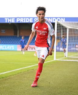 Arsenal U16 player celebrating a goal.
