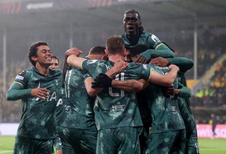 Tottenham Hotspur players celebrating a goal.