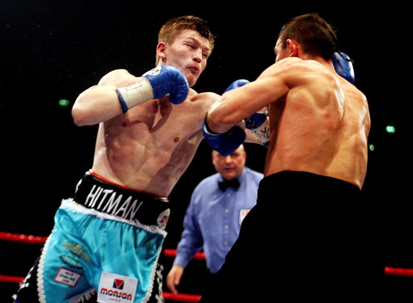 Ricky Hatton landing a punch on Kostya Tszyu during a boxing match.