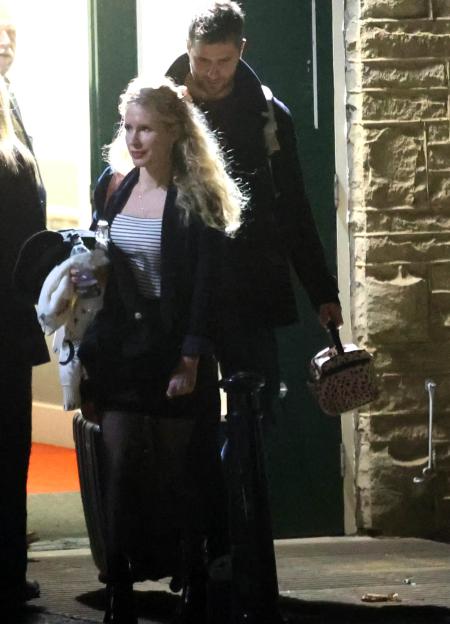 Lucy Beaumont and Martin Wallace leaving a theatre together.