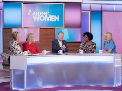 Panel of Loose Women TV show guests at a table.