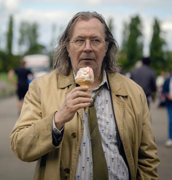Gary Oldman as Jackson Lamb in Slow Horses - Season 3, holding an ice cream cone.