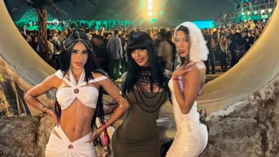 Three women at an outdoor festival in Egypt.