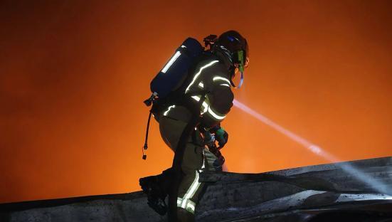 Firefighter battling blaze in Dnipropetrovsk region.