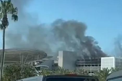 Blaze at Disneyland sends black smoke flying over theme park as fire spreads and emergency services attend