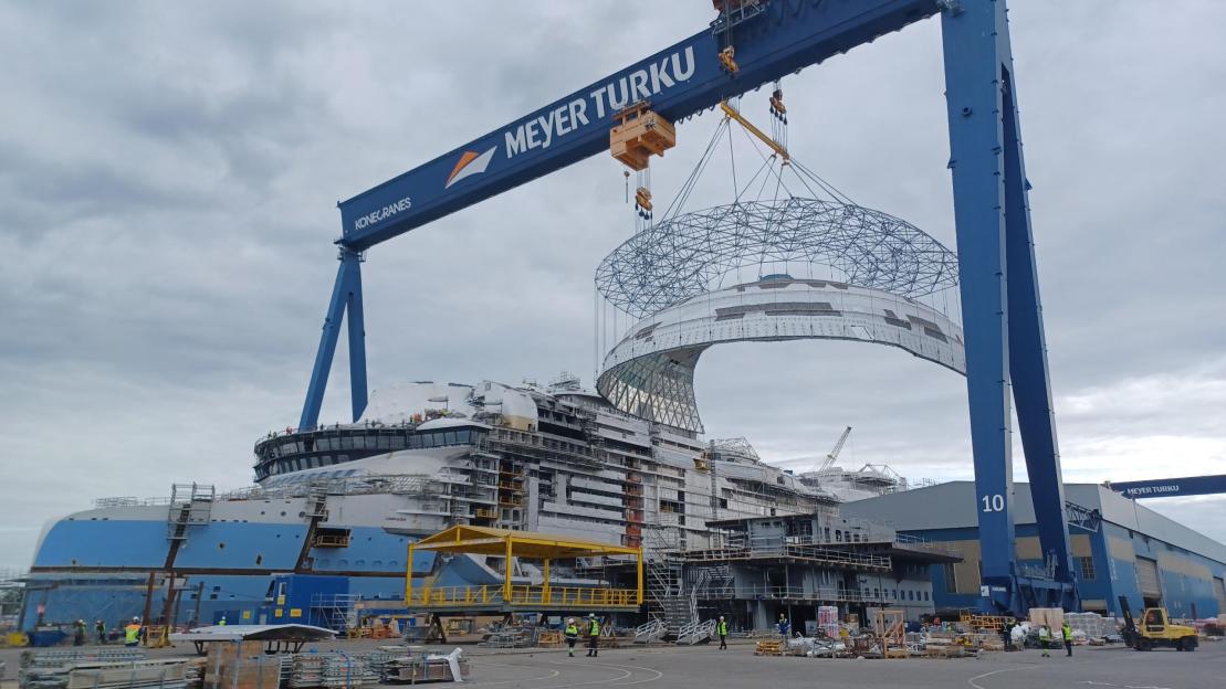 The Legend of the Seas cruise ship under construction in a shipyard.
