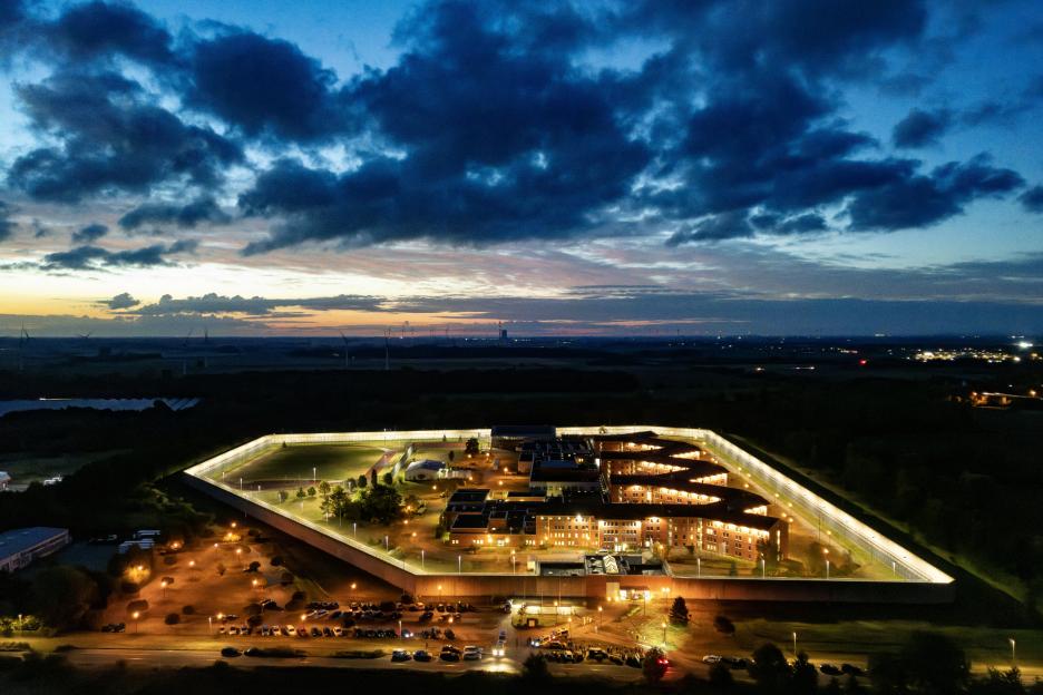 Aerial view of the high-security Justizvollzugsanstalt Sehnde prison in Germany at dusk.