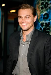 Leonardo DiCaprio smiling at a film premiere.