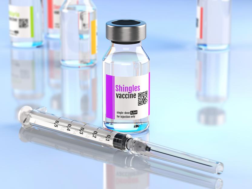 Illustration of a shingles vaccine vial and syringe.