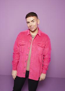 Portrait of Thomas in a pink corduroy shirt.