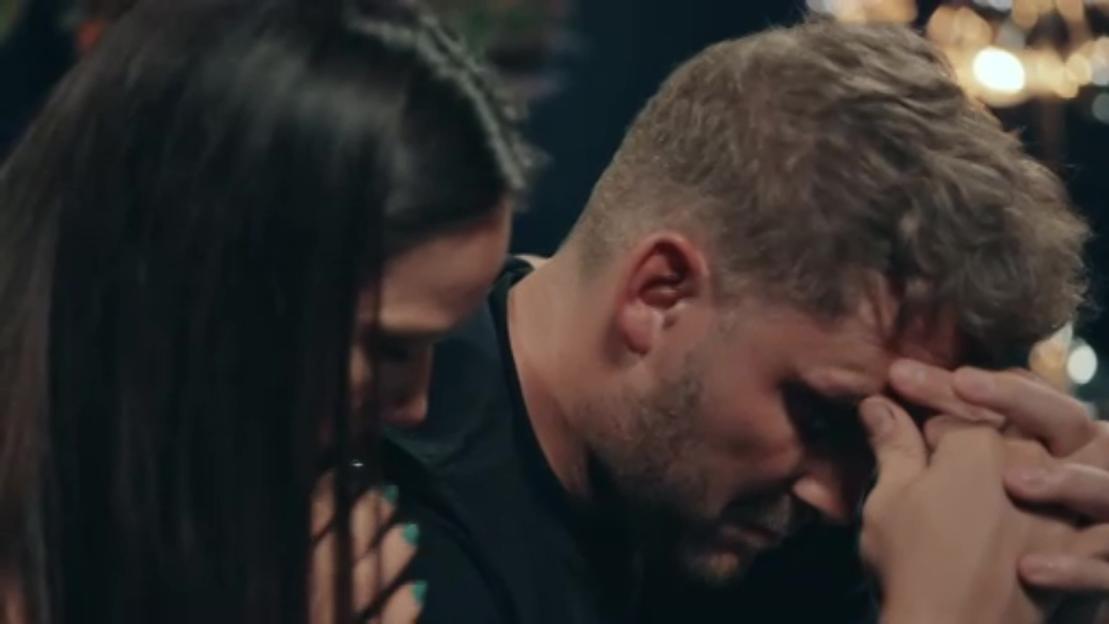 Ashley and Grace crying as Grace places her hand on Ashley's shoulder.