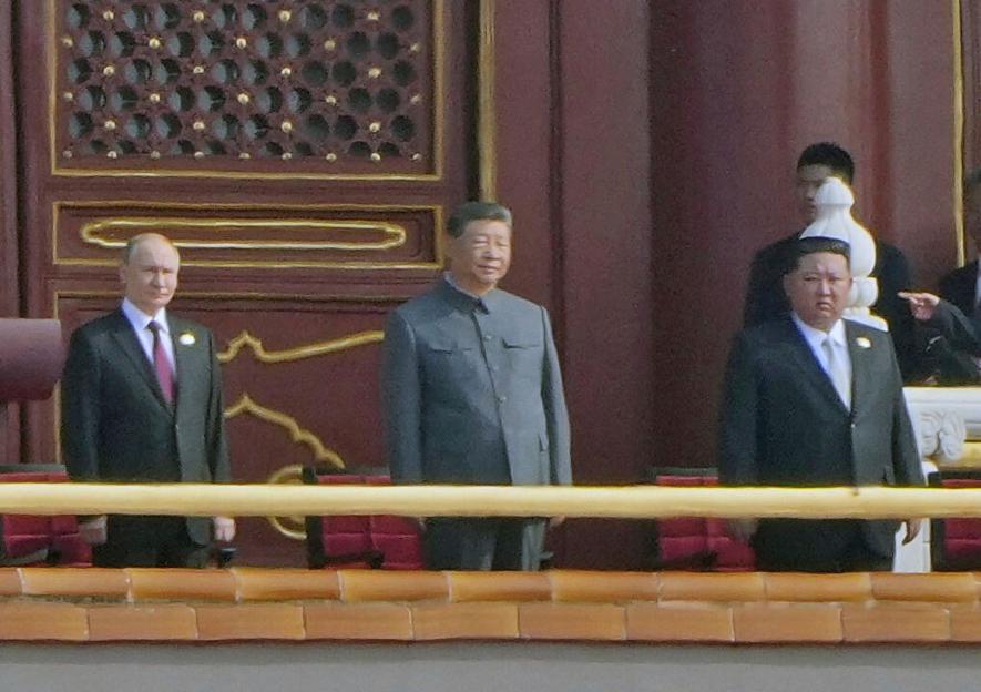 Putin, Xi Jinping, and Kim Jong Un at a military parade.