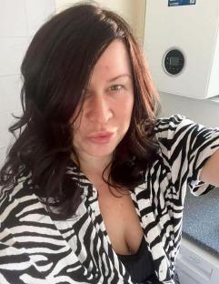 A woman wearing a zebra-striped shirt.