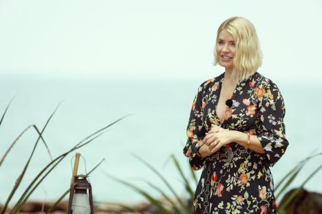 Holly Willoughby walking in a scrubland.