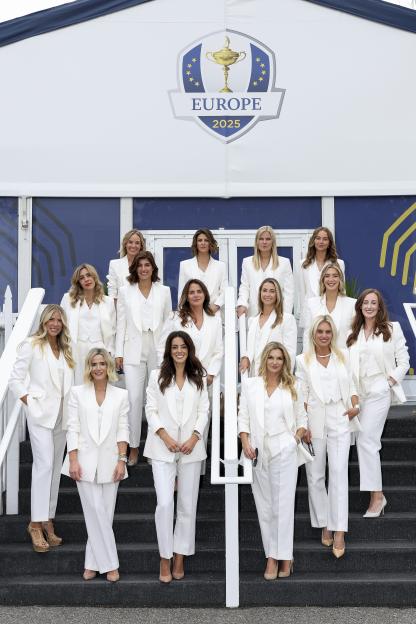 Partners and wives of Team Europe players posing for a photo.