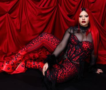 Miriana Conte, representing Malta, in a red and black leopard print outfit.