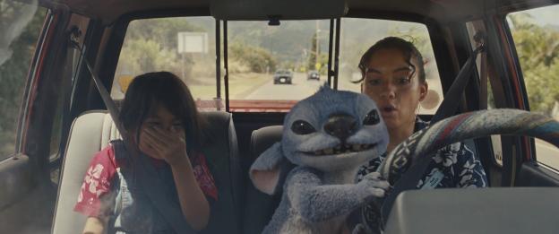 Still from *Lilo & Stitch*, showing Maia Kealoha and Sydney Agudong in a car with Stitch.