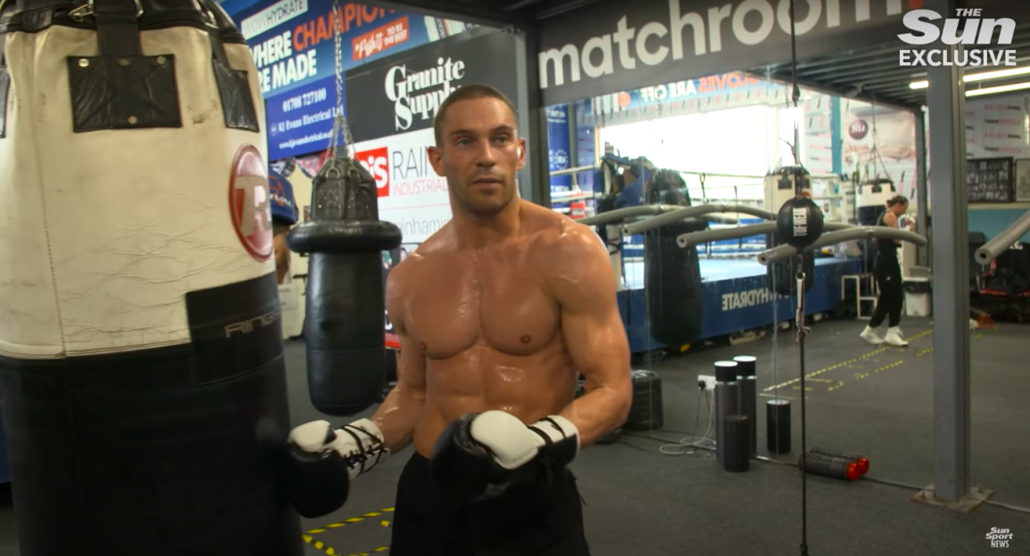 Boxer training in gym.