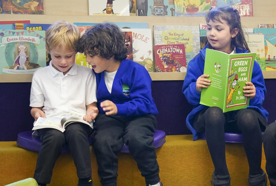 Children from Willow School reading in the library.