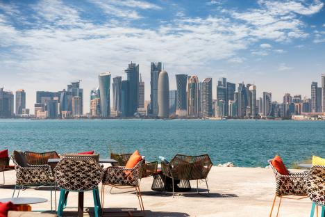 Doha skyline viewed from a waterfront cafe.