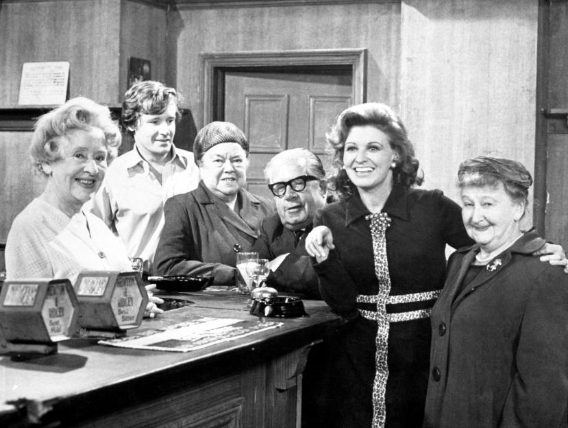 Six actors portraying their characters in the Rovers Return pub from Coronation Street: Doris Speed as Annie Walker, William Roache as Ken Barlow, Violet Carson as Ena Sharples, Jack Howarth as Albert Tatlock, Pat Phoenix as Elsie Tanner and Margot Bryant as Minnie Caldwell.