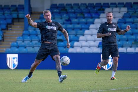 Dan Osborne kicking a soccer ball during a charity match at Gillingham Football Club.