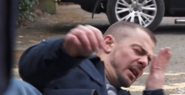 Man in distress on the ground.