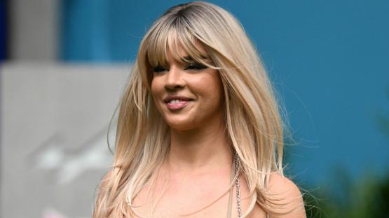 World Cup’s hottest fan looks unrecognisable with dramatic new look as she wears bold F1-themed bra to Miami Grand Prix