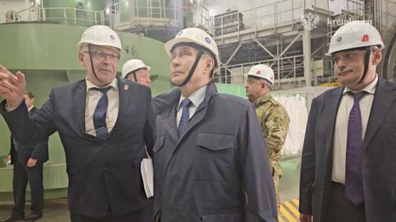 Vladimir Putin visiting a nuclear power plant under construction.