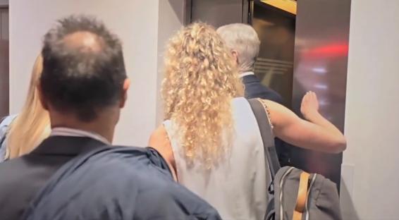 People entering an elevator.