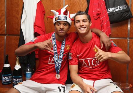 Nani and Cristiano Ronaldo of Manchester United celebrating in the locker room.