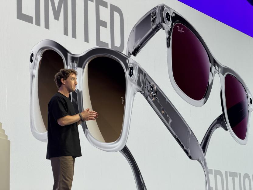 Mark Zuckerberg presenting new Ray-Ban Meta smart glasses on stage.