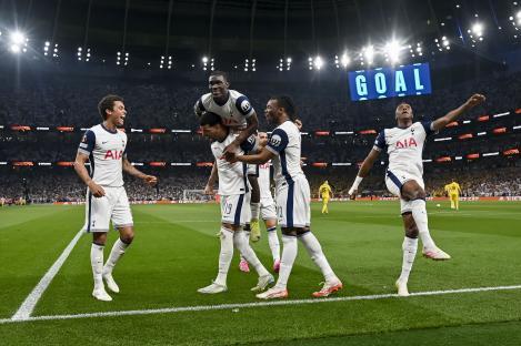 Tottenham Hotspur players celebrating a goal.