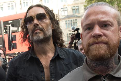 Russell Brand guarded by boxer pal of Tyson Fury as he appeared in court on rape and sex assault charges