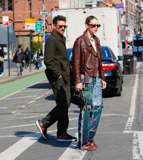 Gigi Hadid and Bradley Cooper walking in New York City.