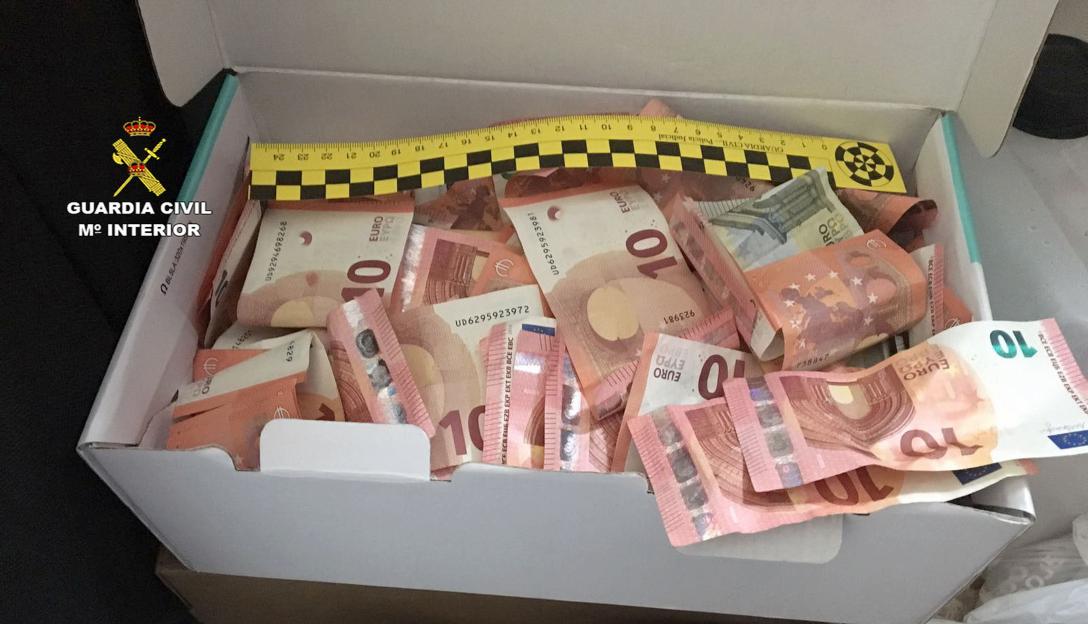 Box of cash seized in a drug bust.