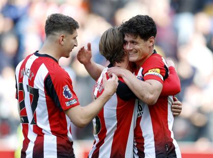 Brentford players celebrating a goal.