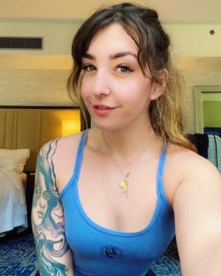 Influencer Sarah Button in a blue tank top.