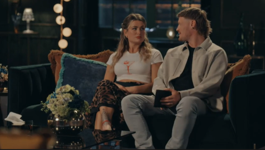 April and Leo sitting on a couch, appearing to discuss their decision to quit.