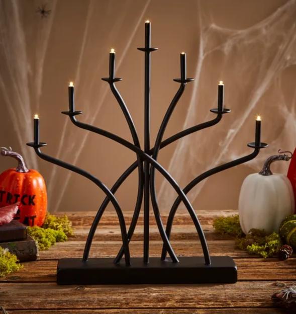 Black metal seven-light candelabra with LED candles.