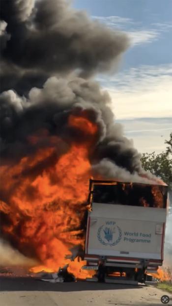 Flames engulf humanitarian vehicle