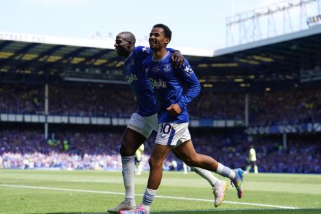 Two Everton soccer players celebrating a goal.
