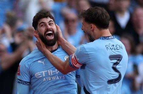 Josko Gvardiol and Ruben Dias celebrating a goal.