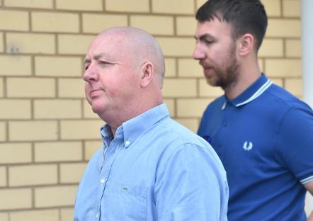 A father and son outside a coroner's court.