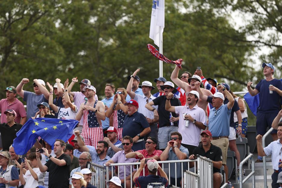 Spectators cheering from the 13th hole grandstand during the Ryder Cup.