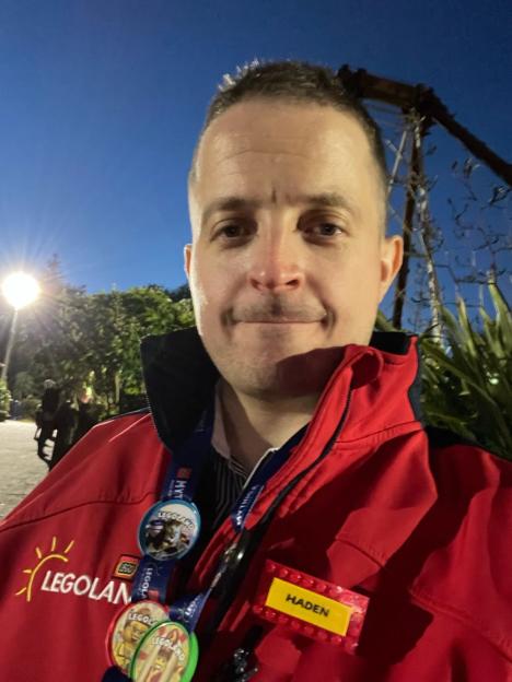 Haden Pentecost wearing a Legoland jacket with a name tag.