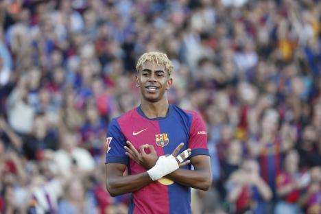 Barcelona's Lamine Yamal celebrates after scoring his side's opening goal during the Spanish La Liga soccer match between Barcelona and Villarreal at Lluis Companys Olympic Stadium in Barcelona, Spain, Sunday, May 18, 2025. (AP Photo/Joan Monfort)