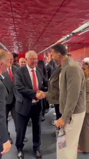 Sir Alex Ferguson and Rio Ferdinand shaking hands.